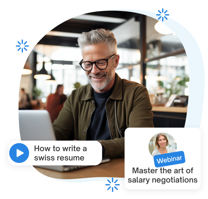 Smiling man with glasses working on a laptop in a cafe, learning on jobs.ch how to write a CV that stands out on the Swiss job market.